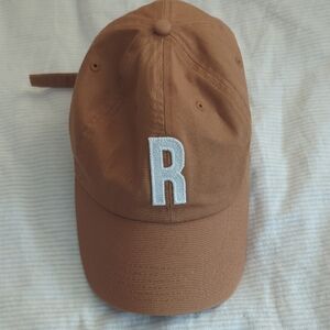 Tan baseball hat with Letter R